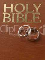 Wedding Rings Resting On A Holy Bible