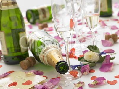 Empty Wine Bottles Among Rose Petals