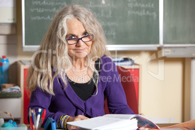 Teacher behind her desk