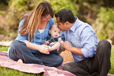 Happy Mixed Race Family Playing In The Park