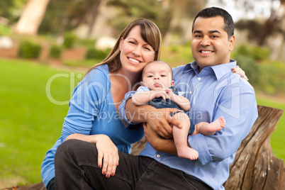 Happy Mixed Race Family Posing for A Portrait