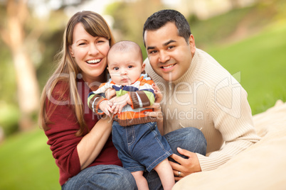 Happy Mixed Race Family Posing for A Portrait