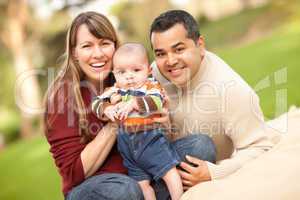 Happy Mixed Race Family Posing for A Portrait