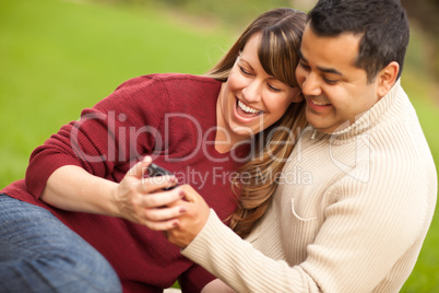 Attractive Mixed Race Couple Enjoying Their Camera Phone