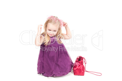 Studio shot of baby girl in gala dress