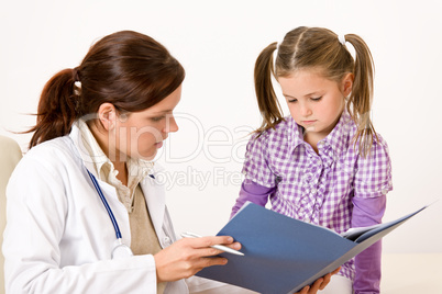 Female doctor with child at medical office
