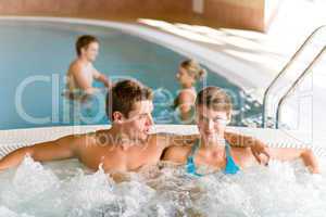 Swimming pool - young couple relax in hot tub