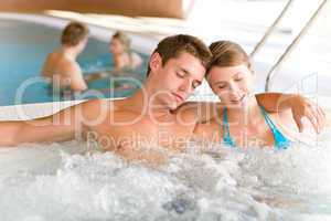 Swimming pool - young couple relax in hot tub
