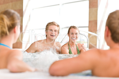 Swimming pool - happy couple relax in hot tub