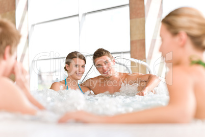 Swimming pool - happy couple relax in hot tub