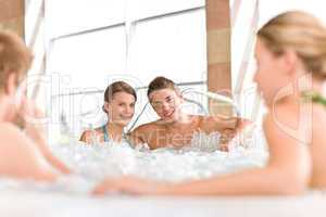 Swimming pool - happy couple relax in hot tub