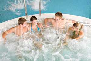 Top view - happy people relax in hot tub