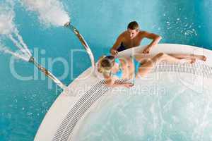 Top view - young couple relax in swimming pool