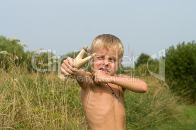 Boy with a slingshot.