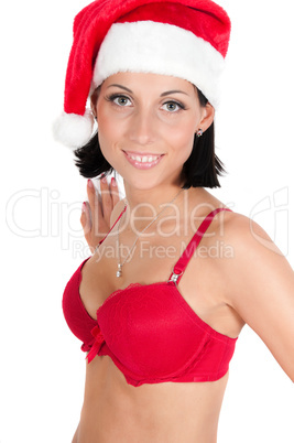 Portrait of beautiful woman in red santa hat