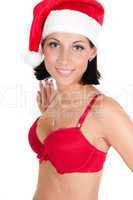 Portrait of beautiful woman in red santa hat