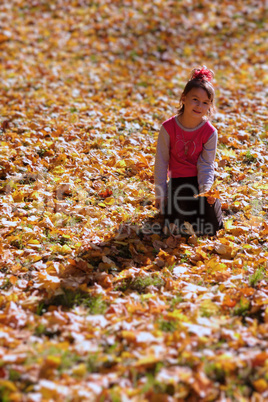 Girl at bright autumn