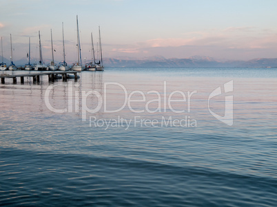 Yachts at dock in sunset