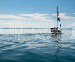 White yacht sailing on calm sea