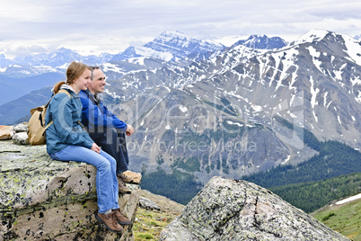 Father and daughter in mountains