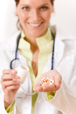 Female doctor with stethoscope holding tablet