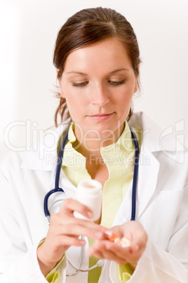 Female doctor with stethoscope holding tablet