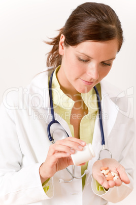 Female doctor with stethoscope holding tablet