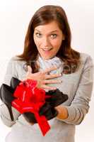 Surprised woman holding present shoes
