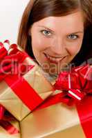 Happy woman holding Christmas presents