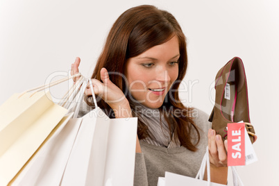 Shopping - woman holding shoes and bags