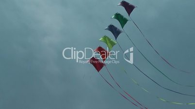 Colorful kite soaring against blue sky