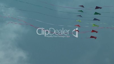 Colorful kites flying against blue sky