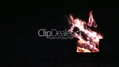 Campfire with black background on left