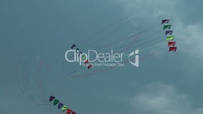 Three kites flying over a  sky