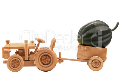 Toy tractor with green pumpkin.