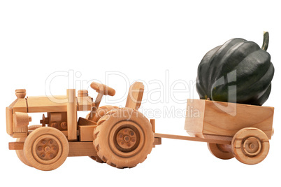 Toy tractor with green pumpkin.