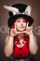 Attractive Red Haired Woman Wearing Bunny Ear Hat Framing Face