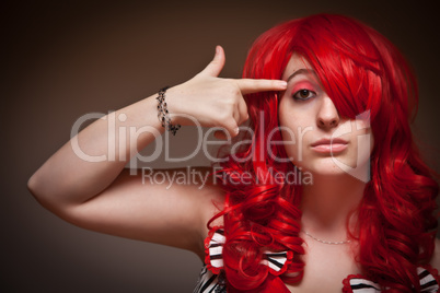 Attractive Young Red Haired Woman with Hand To Her Head