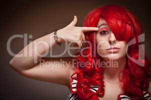Attractive Young Red Haired Woman with Hand To Her Head