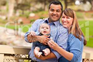 Happy Mixed Race Family Posing for A Portrait