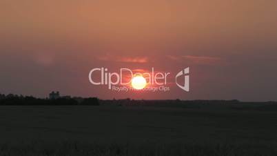 Sunrise on red sky - countryside scene background time-lapse