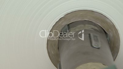 close shot of roll of white paper rotating