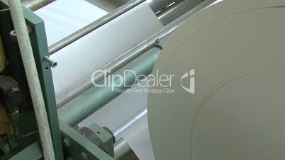huge roll of paper on industrial press