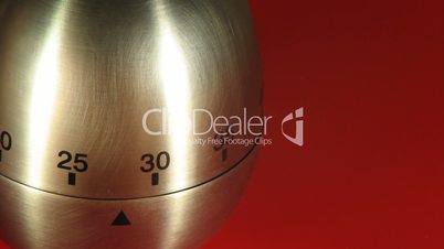 Egg Kitchen Timer on a Red Table