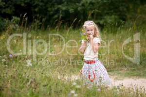 little girl with wild flowers