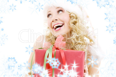 cheerful santa helper girl with gift box