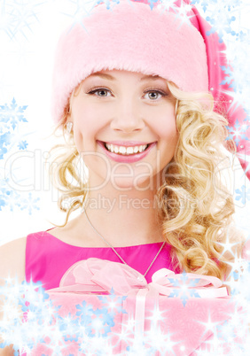 cheerful santa helper girl with gift box