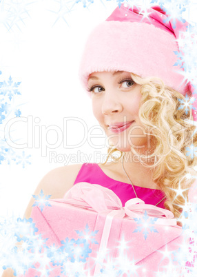cheerful santa helper girl with gift box
