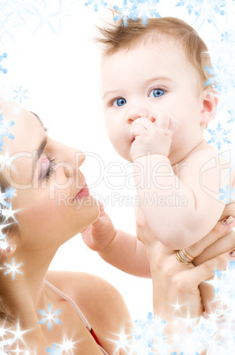 blue-eyed baby in mother hands