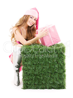 santa helper with gift box and green cube